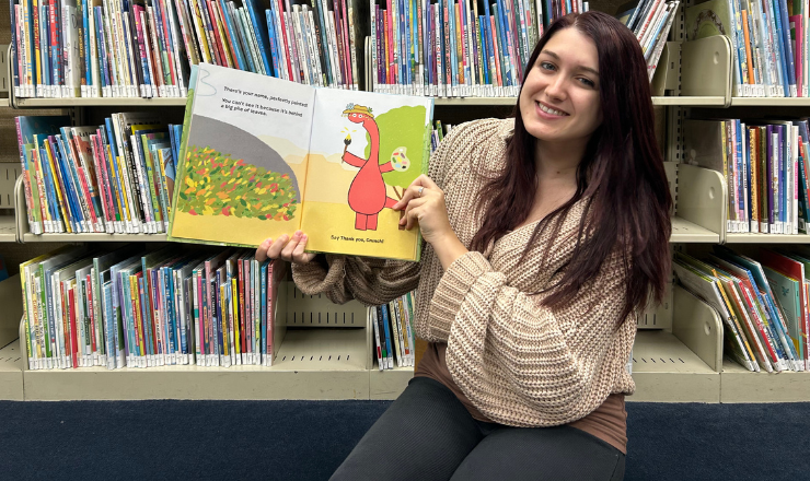 Ms. Dana reading a book